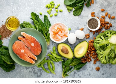 Omega 3 natural food sources concept, top down view of fresh food ingredients containing both plant or animal sources of Omega 3