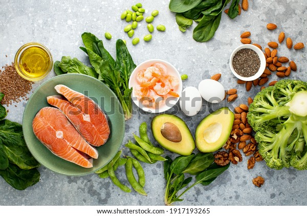 Omega 3 natural food sources concept, top down view of\
fresh food ingredients containing both plant or animal sources of\
Omega 3