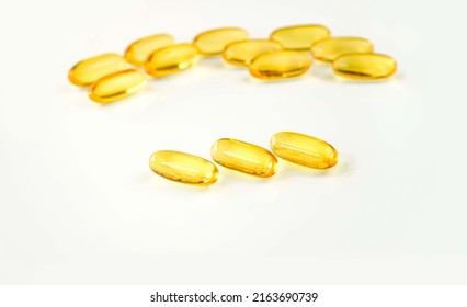 Omega 3. Oily Fish, In Capsules, On A White Background. Omega3. Healthy Food. Vitamin D, E, Fish Oil Capsules.