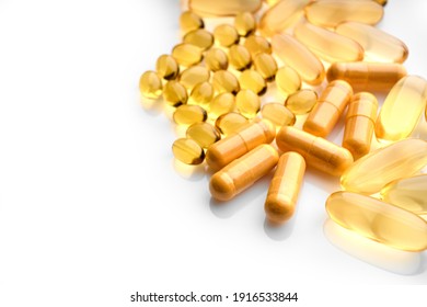 Omega-3 Fish Fat Oil Capsules. Fish oil capsules isolated on white background. Close up of capsules Omega 3 on white background. Health care concept. Nutritional supplements. Vitamins