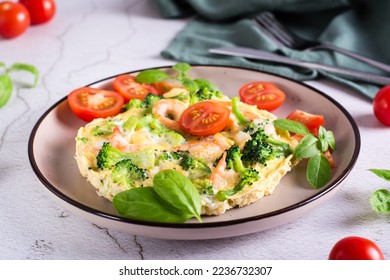 Omelet with broccoli and shrimp on a plate on the table. Homemade Protein Meal