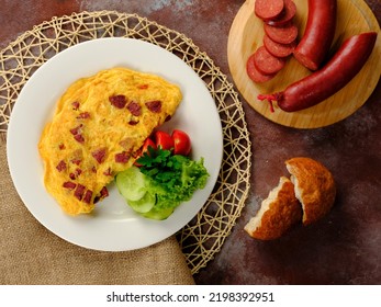 omelet with sausage on stage with composition