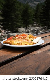 omelette on plate in the mountains