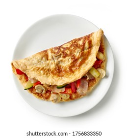 Omelette Stuffed With Vegetables And Bacon On White Plate Isolated On White Background, Top View