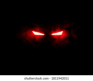 Ominous Luminous Eyes Staring Out Of The Darkness Illuminate With Rays Of Red Light Swirling White Smoke