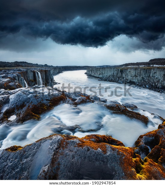 Ominous sky over the Selfoss cascade. Location\
place Vatnajokull National Park, Iceland, Europe. Photo wallpaper.\
Dangerous weather conditions. Popular world landmarks. Discover the\
world of beauty.