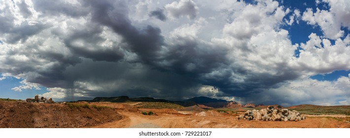 Ominous Stormy Sky And Cumulus Clouds With Rain Pano In The Desert.