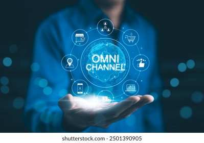 Omni Channel Marketing Concept. Businessman holding digital representation of omni-channel marketing, e-commerce, delivery, social media, analytics, customer engagement, and customer service icons.