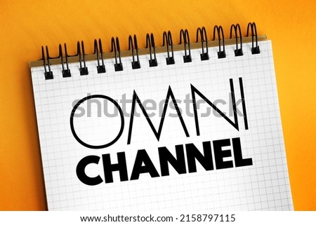Omni channel - neologism portmanteau describing an advertising strategy, text concept on notepad