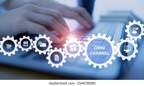 Omnichannel marketing concept. Digital online marketing commerce sale. For customer engagement by integrated online and offline channels. Person working on computer with the icons of omni channel.