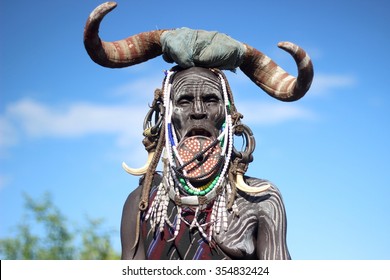 OMO VALLEY, ETHIOPIA - CIRCA NOVEMBER 2015: Portrait of a Mursi woman wearing the symbolic clay plate she is famous for.