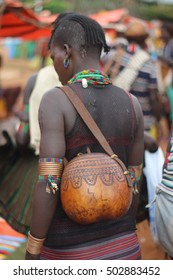 OMO VALLEY, ETHIOPIA - CIRCA NOVEMBER 2015: A Banna woman carrying her calabash at the weekly Key Afer market.