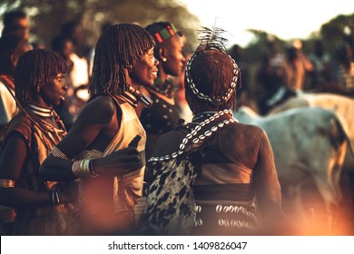 Omo Valley, Ethiopia - November 09, 2018: Hamer and Banna tribe women singing and dancing in Hamer tribe ritual, Omo Valley, Ethiopia