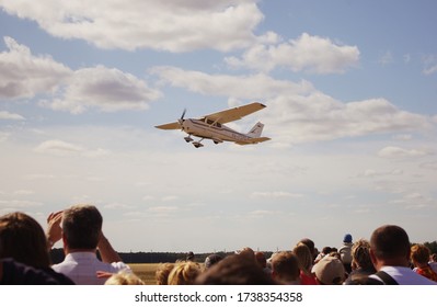 Omsk city / Russia - august 18, 2012: white light airplane Cessna 172N Skyhawk flew past viewers at local airshow 