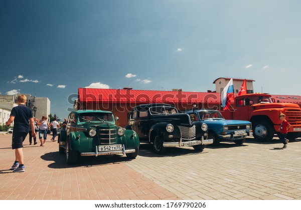 Omsk city\
/ Russia - june 24, 2020: range of classic cars takes part in the\
parade in honor of a Victory day. Custom car project Moskvich 401\
based, 1939 Ford DeLuxe and other\
oldtimers