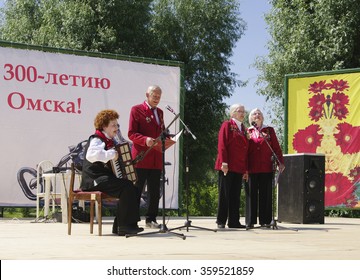 Omsk, Russia - June 12, 2015: Vocal-instrumental Ensemble Of Veterans Performs On Outdoor Concert Venue