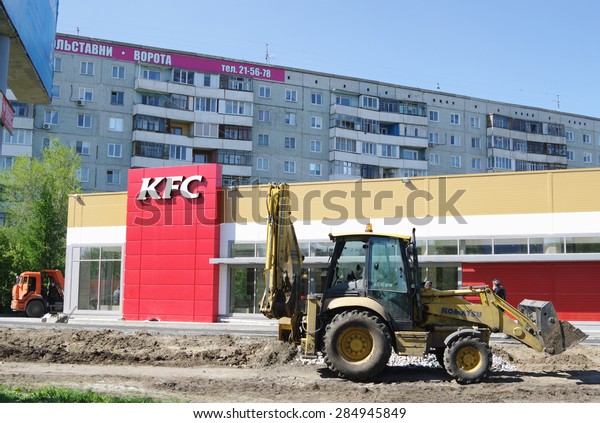 OMSK, RUSSIA - MAY 12, 2015:\
Landscaping in front of new building of network  KFC\
restaurant.
