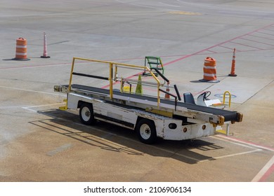 On Airport Conveyor Belt Overhead View To Airplane