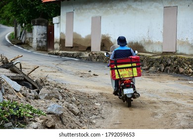 On August 4, 2020, A Post Office Courier Works On A Motorcycle In The Flood Damage Area Of Samgok-dong, Jecheon-si, South Korea.