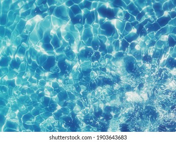 Reflection​ on surface​ blue​ water​ for​ background.  Abstract​ of​ surface​ blue​ water​ for​ background.