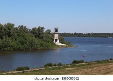 On The Bifurcation Of The River Stands A Lonely Lighthouse.