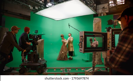 On Big Film Studio Professional Crew Shooting Period Costume Drama Movie. On Set: Director Controls Cameraman Shooting Green Screen Scene with Two Actors Talented Wearing Renaissance Clothes Talking - Shutterstock ID 1793697874