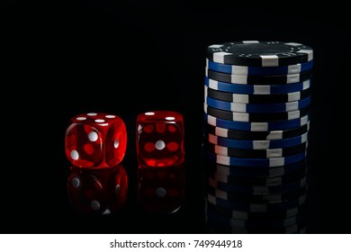 on a black background, two red dice and a bet for the game