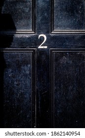 On A Black Wooden Front Door Is The Number Two