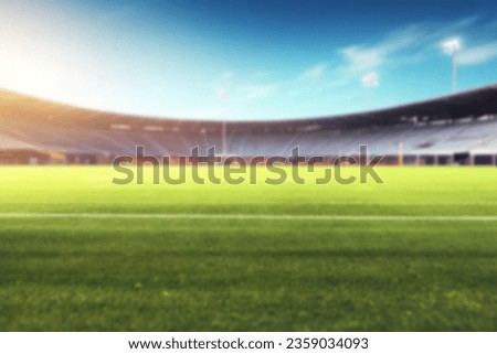 On the blurred background of the empty football field