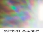 On a bright early spring day the sun is shining through a window with prismatic glass and creating a beautiful wash of rainbow light on the whitewashed wall opposite - Background Texture 
