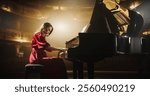 On a Bright Golden Concert Stage, Female Pianist Delivers an Emotional Improvisation on a Grand Piano. Each Note Resounds Through the Concert Hall, Exciting the Audience. Focus on Hands