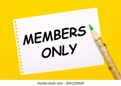 On A Bright Yellow Background, A Large Wooden Pencil And A White Sheet Of Paper With The Text MEMBERS ONLY