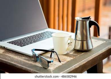 
On the coffee table with a computer