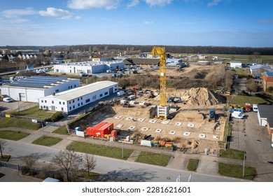 on a construction site large foundations are poured for the pillars of a factory building - Shutterstock ID 2281621601
