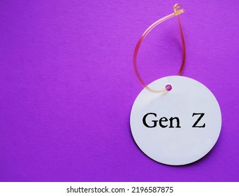 On Copy Space Purple Background, Luggage Tag With Text  GEN Z, Means Generation Z Or Zoomers Who Was Born 1997-2012, Following Millennials - Raised On Internet And Social Media