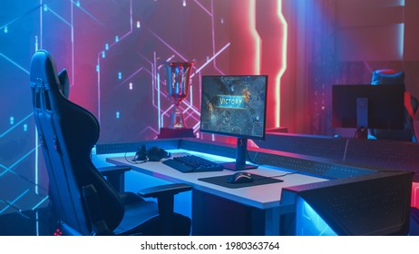 On Cyber Gaming Championship: Empty Gaming Station with Player's Computer Screen Showing Video Game Victory. Online Cyber Gaming Tournament Live Streaming Event