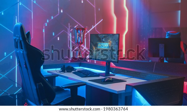 On Cyber Gaming\
Championship: Empty Gaming Station with Player\'s Computer Screen\
Showing Video Game Victory. Online Cyber Gaming Tournament Live\
Streaming Event