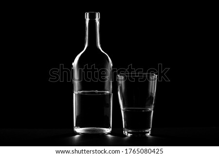 Image, Stock Photo a small glass of coffee and a white flower on a walnut table