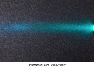 On a dark purple gradient background in white grain, a turquoise gradient beam of light
