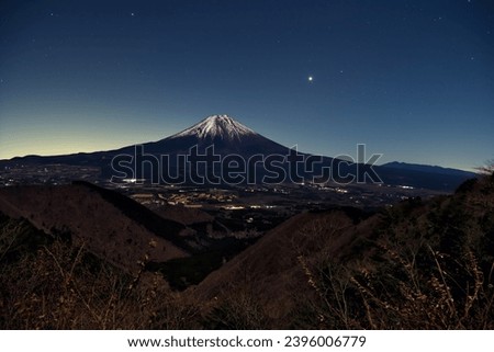 On December 2, 2023, Mt. Fuji illuminated by the moonlight, with Venus rising in the pre-dawn sky as a nice accent.