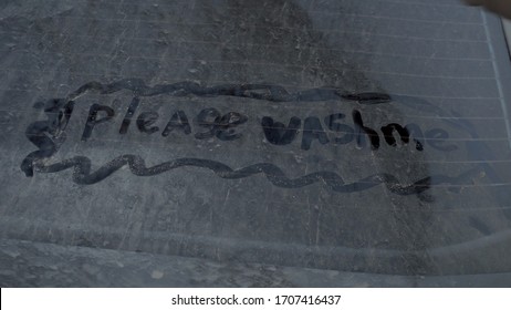 On A Dirty Car Is Written: Please Wash Me. Prank Over The Owner Of A Black Car.