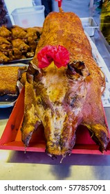 On the fifteenth of the Chinese New Year,chinese businessman would buy whole roasted pig to offer to their god / Roasted pig / After prayers,strips are given to friends and relatives as token gestures