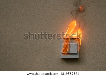 On fire switch electric shock on concrete wall