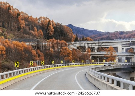 On a highway leads to Takayama from Shirakawa. Beautiful autumn view of the road through the tunnel in the mountains. 