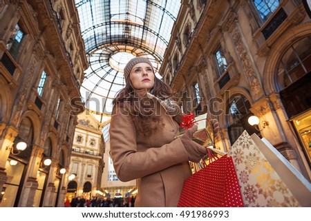 Similar – Image, Stock Photo A woman iis looking at her smartphone outdoors.