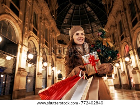 Similar – Image, Stock Photo A woman iis looking at her smartphone outdoors.