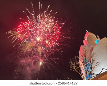 On January 28, 2025, in Nha Trang, fireworks light up the night sky above the iconic Agarwood Tower (Lotus Tower), creating a vibrant festive atmosphere.