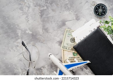 On A Light Background, A Toy Airplane, Documents, Money. Travel Planning, Air Travel. An Exciting Adventure, Vacation, Vacation, Business Trip. There Are No People In The Photo. Banner.