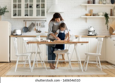 On Modern Warm Kitchen Mother And Little Daughter Preparing Domestic Pie Full Length, Mom Helping Teaching Pre-school Kid Girl Shares Family Pastry Recipe, Enjoy Pastime Hobby Together At Home Concept