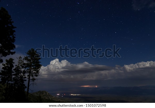 On a Mountain with
Storm in the Distance